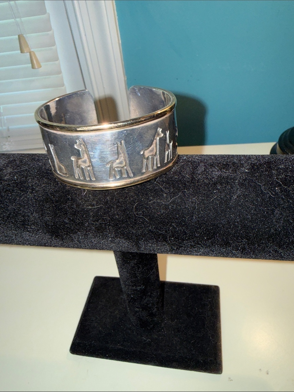 Simba Africa handmade cuff bracelet featuring embossed animal silhouettes.